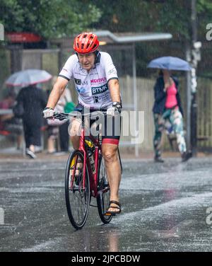 Wet weather finally in London after rough conditions  heavy showers caught out some others had come prepared with umbrellas around Highgate North  Lon Stock Photo