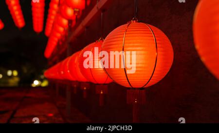 Close-up image, Traditional red Chinese lanterns hanging on the ceiling background, Chinese New Year festival. 3d rendering, 3d illustration Stock Photo