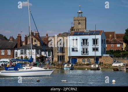 WIVENHOE IN ESSEX, PICTURED FROM THE OPPOSITE SHORE (ROWHEDGE). THE ROSE AND CROWN PUB IS VISIBLE Stock Photo