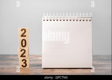 2023 time for new start. Plan words and 2023 cubes wooden table background. New Year. Calendar desk 2023 for organizer to plan and reminder on wooden Stock Photo