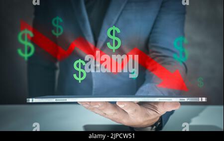 Businessman making decrease chart. businessman shows tablet with graph of economic recession, profit reduction, inflation. Global financial crisis Stock Photo