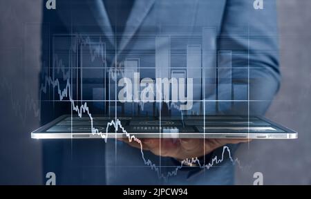 Businessman using tablet and laptop analyzing sales data and economic growth graph chart. Business strategy. Digital marketing. Tablet and business gr Stock Photo