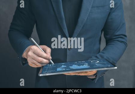 Cropped view of businessman using digital tablet. Digital technology, internet network connection, big data, digital marketing. Technology in business Stock Photo