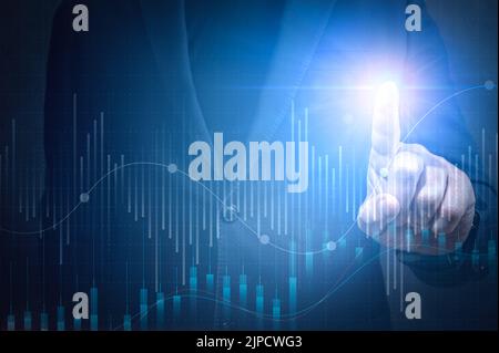 Business growth concept. Businessman plan growth and increase of positive indicators in his business. Businessman Touching Chart Indicating Growth. Stock Photo