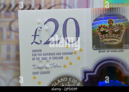A closeup of £20 Twenty pounds cash money bill Sterling polymer banknote from the bank of England that features the queen and J. M. W. Turner, selecti Stock Photo