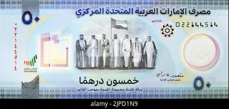 Large Fragment of obverse side of the new polymer commemorative 50 fifty Dirhams with Memorial to the martyrs of the Emirates UAE, seven founding fath Stock Photo