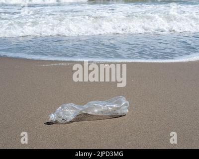 Plastic bottle on the beach Plastic garbage Stock Photo