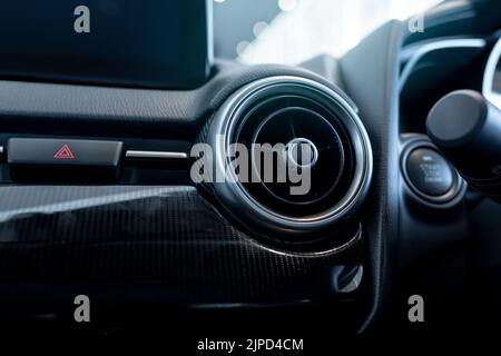 Car air vent. Car air conditioner. Automobile air conditioning system. Car ventilation system. Auto interior. Ventilation system in vehicle. Round air Stock Photo