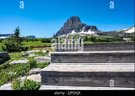 Wooden steps leading to Hidden Lake Overlook trail from the Logan Pass Visitor Center at Glacier National Park.  Stock Photo