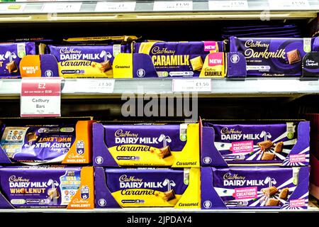 Epsom Surrey, August 14 2022, Selection Of Cadbury Chocolate Bars On Supermarket Shelf Stock Photo