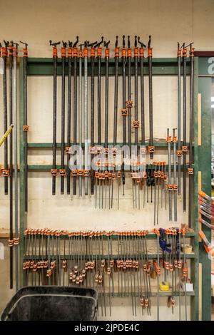 Kalamazoo, Michigan - Clamps hanging on the wall at the Homestead Cabinetmakers shop, located in the Park Trades Center. Stock Photo