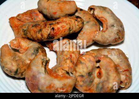 Mumbar which is a stuffed intestines with minced meat, rice, tomato paste, onion, salt, black pepper, allspice and cinnamon ready to be fried in deep Stock Photo