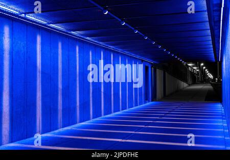 blue neon lights in a tunnel Stock Photo