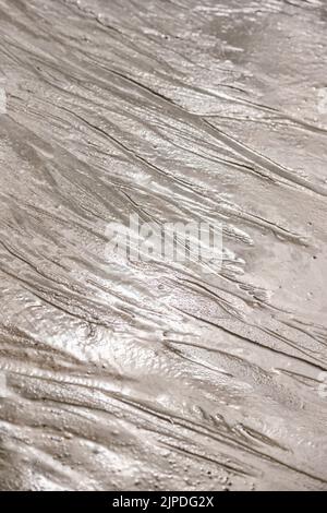 natural sand pattern on the beach. Sand surface with pattern, sand texture background Stock Photo