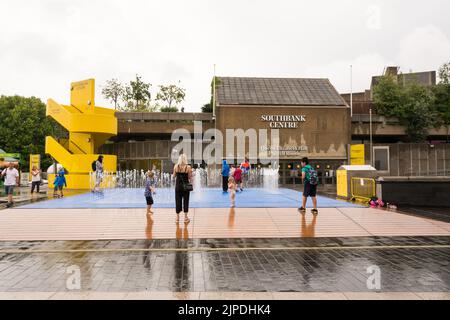 The drought & heatwave in the UK is finally over - Children playing in Jeppe Hein's Appearing Rooms water fountain installation on London's Southbank Stock Photo