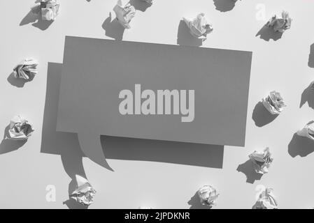 Speech Bubble On Floor With Important Data Written In With Paper Wraps And Magnifier Around. Dialogue Balloon On Ground With Crutial News Inside And Stock Photo