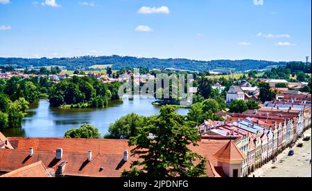 Telc, Czech Republic, July 2, 2022: Large lake for recreation behind the historical market square of Telc, aerial view Stock Photo