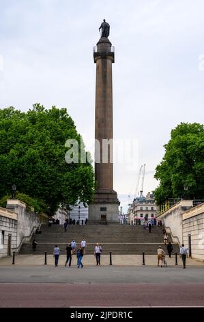 LONDON - May 18, 2022: People walk in front of Duke of York Monument on The Mall Stock Photo
