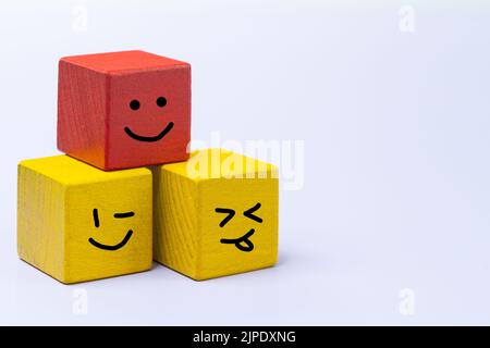 smiling faces, drawn on colored wooden blocks, Concept, positive attitude, Instilling good role models in children, Copy space Stock Photo