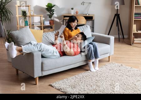 High angle view of beautiful chinese couple relaxing at home Stock Photo