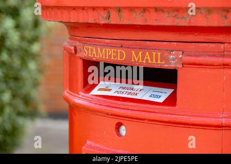 Newcastle-under-Lyme, Staffordshire-united kingdom August,  14, 2022 queen elizabeth duel post box in pillarbox red one side for stamped mail the othe Stock Photo