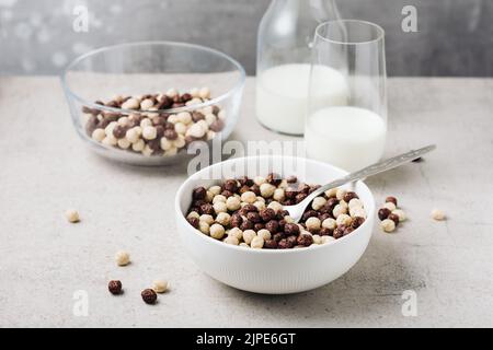 Breakfast cereal balls and milk on a table. Stock Photo