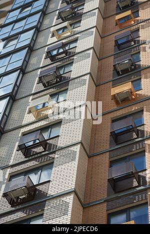 Building exterior with decorative air conditioner covers Stock Photo