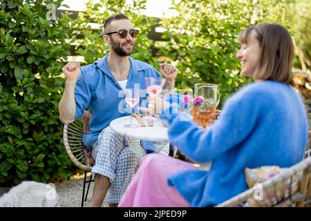 Stylish couple spend romantic evening at backyard Stock Photo