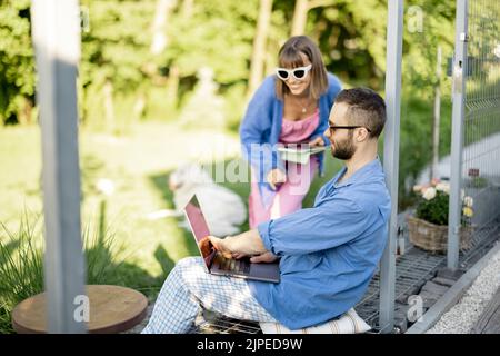 Couple work on laptop computer on nature Stock Photo