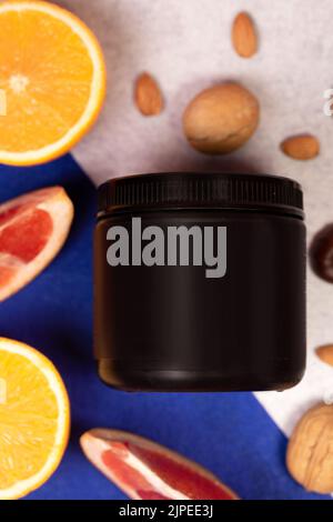 black plastic jar without logo and fruit. Stock Photo