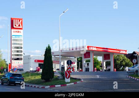 Bucharest, Romania - June 22, 2022: A Lukoil gas station is seen at night in Bucharest Editorial stock photo - stock image Stock Photo