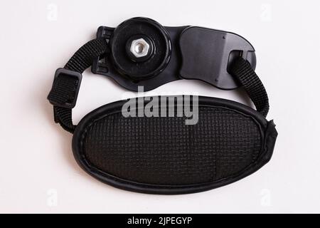black leather camera strap on white background. Stock Photo
