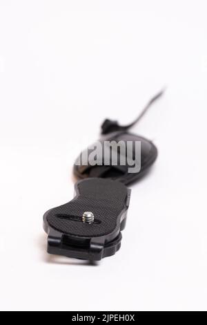 black leather camera strap on white background. Stock Photo