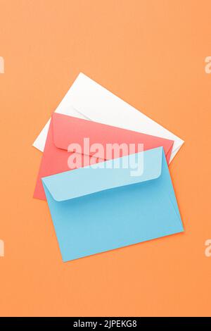 Multicolored paper postal envelopes. Top view Stock Photo