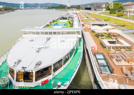 Linz, Austria (7th August 2022) - The different decks of two cruise ships on the river Danube in Linz Stock Photo