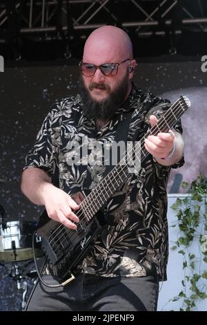 Winchester, UK. 14th Aug, 2022. Jonathan 'Jon' Doyle bass guitar player with British reggae punk band The Skints seen performing live on the Grand Central stage during the Fair Festival. Boomtown is a British music festival held every year on the Matterley Estate in South Downs National Park, near Winchester. (Photo by Dawn Fletcher-Park/SOPA Images/Sipa USA) Credit: Sipa USA/Alamy Live News Stock Photo