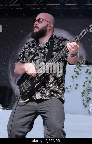 Winchester, UK. 14th Aug, 2022. Jonathan 'Jon' Doyle bass guitar player with British reggae punk band The Skints seen performing live on the Grand Central stage during the Fair Festival. Boomtown is a British music festival held every year on the Matterley Estate in South Downs National Park, near Winchester. (Photo by Dawn Fletcher-Park/SOPA Images/Sipa USA) Credit: Sipa USA/Alamy Live News Stock Photo