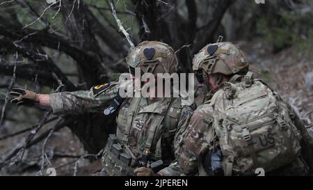 Aug 16, 2022 - Fort Hood, Texas, USA - Sergeant First Class Brandon Rodriguez and Sergeant Andrew Row from 2nd Brigade Combat Team Strike 101st Airborne Division (Air Assault), 18th Airborne Corps, determine which path to take to get to an objective point during the FORSCOM Best Squad Competition on Fort Hood, Texas, August 16, 2022. Each of these events are designed to test the physical and mental toughness along with the lethality of each squad to see which squad will represent FORSCOM at the Best Squad of the Army competition that will take place at Ft. Bragg (Credit Image: © U.S. Army/ZUMA Stock Photo