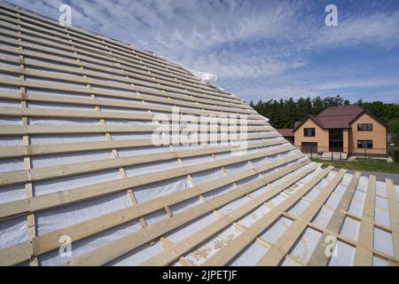 Roof construction and waterproofing under metal tiles Stock Photo