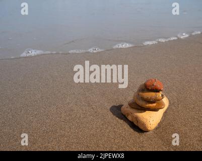 Zen stones on a beach Stock Photo