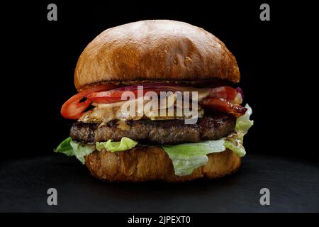 Burger with beef and cottage cheese on a black background, Horizontal Stock Photo