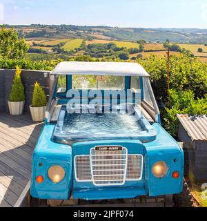 Land Rover hot tub, Bluebird caravan, High Bickington, North Devon, England, United Kingdom. Stock Photo
