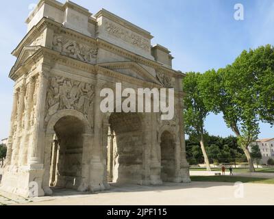 The Triumphal Arch of Orange is an Ancient Roman monumental gate, originally built in the first century and now a well-preserved historic landmark. Stock Photo