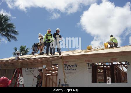 workers installing roof Stock Photo