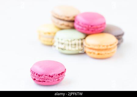 Close up of red macarons on the white  lace background. Stock Photo