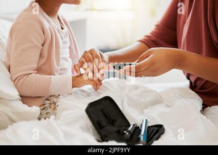 Needle, finger monitor and blood testing by medical care professional at home or hospital appointment. Pathology, healthcare and nurse consulting Stock Photo