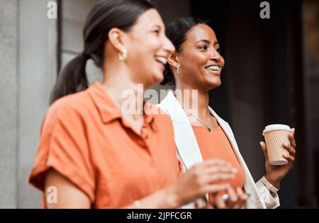 Teamwork, laughing and walking business colleagues on coffee or lunch break in city, town or downtown. Smiling, happy and motivated creative women Stock Photo