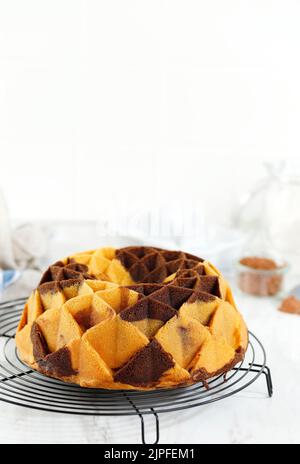 Marble Bundt Cake or Marmer Cake on White Wooden Table. Bundt Cake Easter. Stock Photo