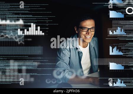 Theres no code he cannot crack. a young computer programmer looking through data in the dark. Stock Photo