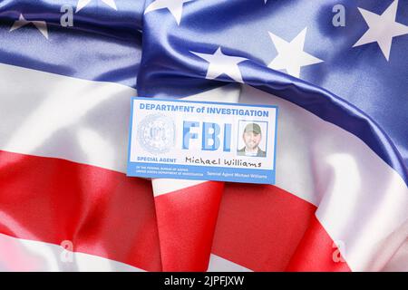 Document of FBI agent on flag of USA Stock Photo